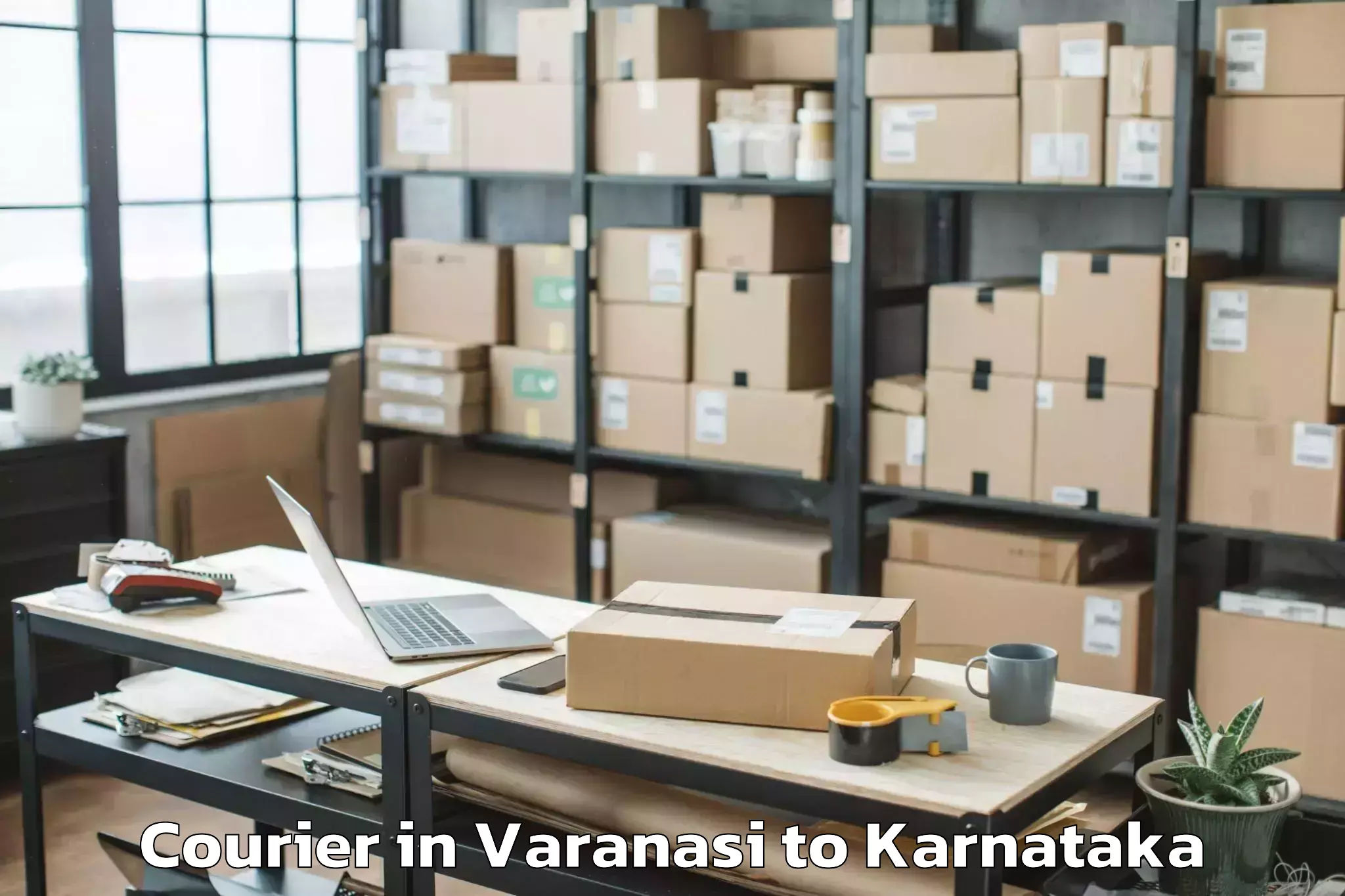 Quality Varanasi to Sri Devaraj Urs Academy Of Hig Courier